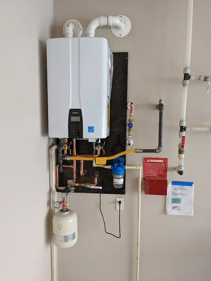 Professional plumber installing copper piping in a Shady Shores home